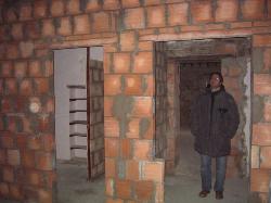 Mauritzio inspecting the new vestibule and bathroom in a first floor bedroom