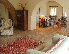 The sitting room with left, the arch leading to the dining room