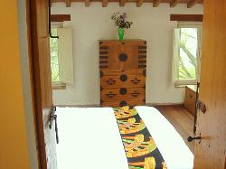 Looking through the bathroom doors into the bedroom
