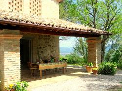 Facing west, the portico has wonderful views along the Niccone valley