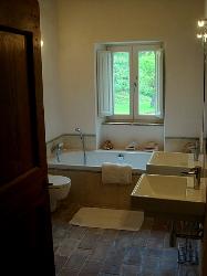 En-suite bathroom fitted with bath, shower, loo, double sinks