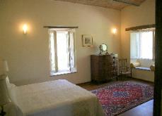 The airy second bedroom, with barrel vaulted ceiling and good views of the garden 